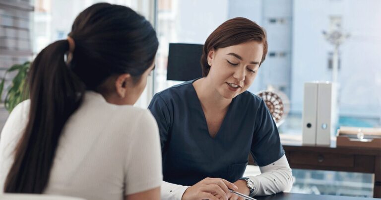 Woman discussing ectopic pregnancy concerns with a healthcare professional during a consultation